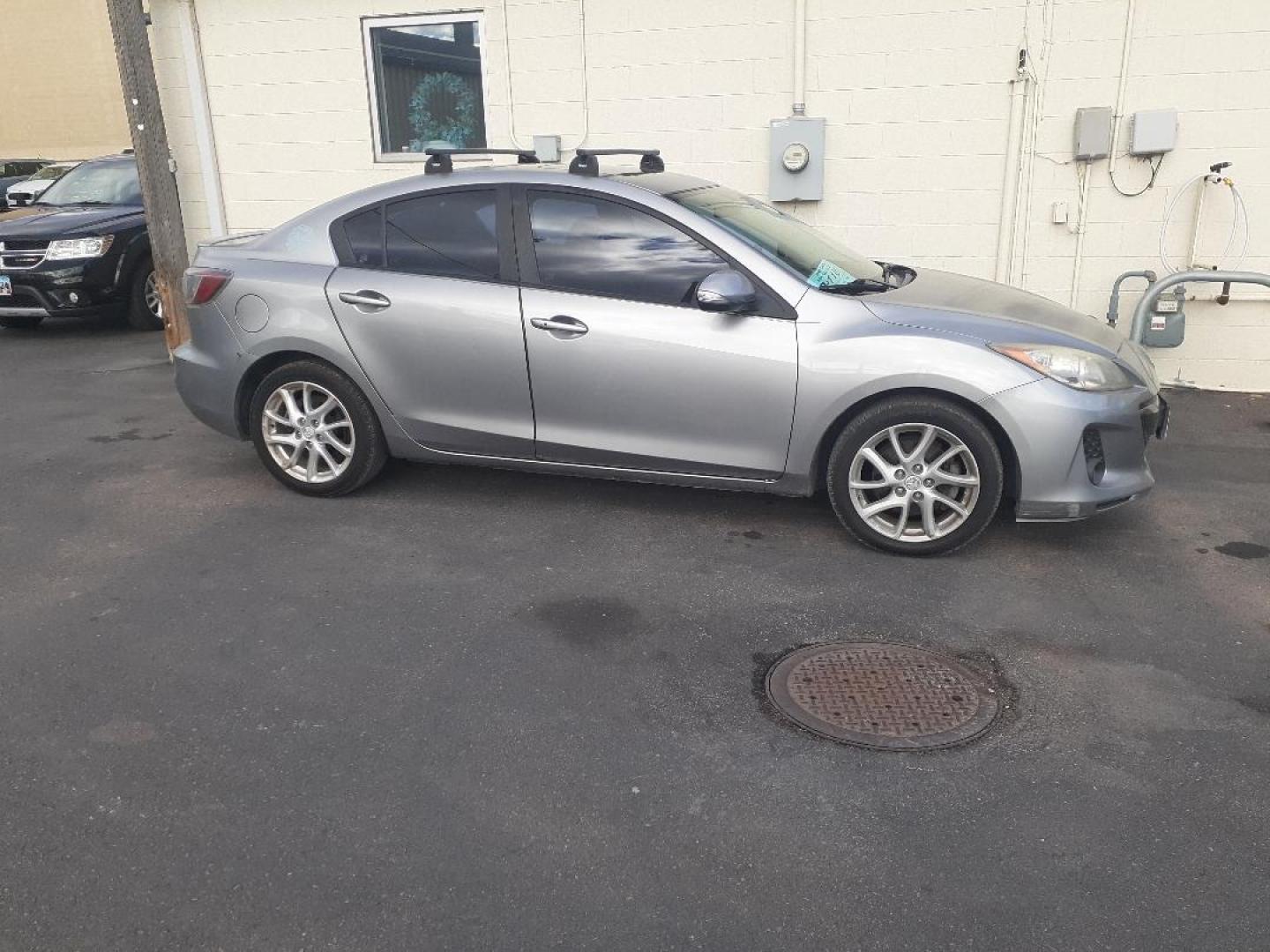 2012 Mazda MAZDA3 s Grand Touring 4-Door (JM1BL1W64C1) with an 2.5L L4 DOHC 16V engine, located at 2015 Cambell Street, Rapid City, SD, 57701, (605) 342-8326, 44.066433, -103.191772 - CARFAX AVAILABLE - Photo#1